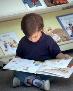 Child reading children's book